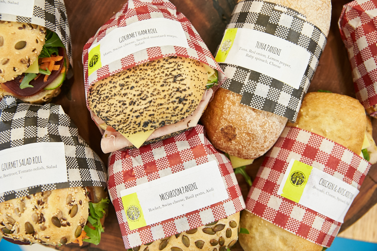 A photo of a collection of rolls and sandwiches