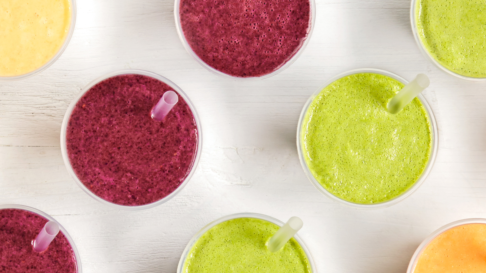 A top down photo of different juices and smoothies