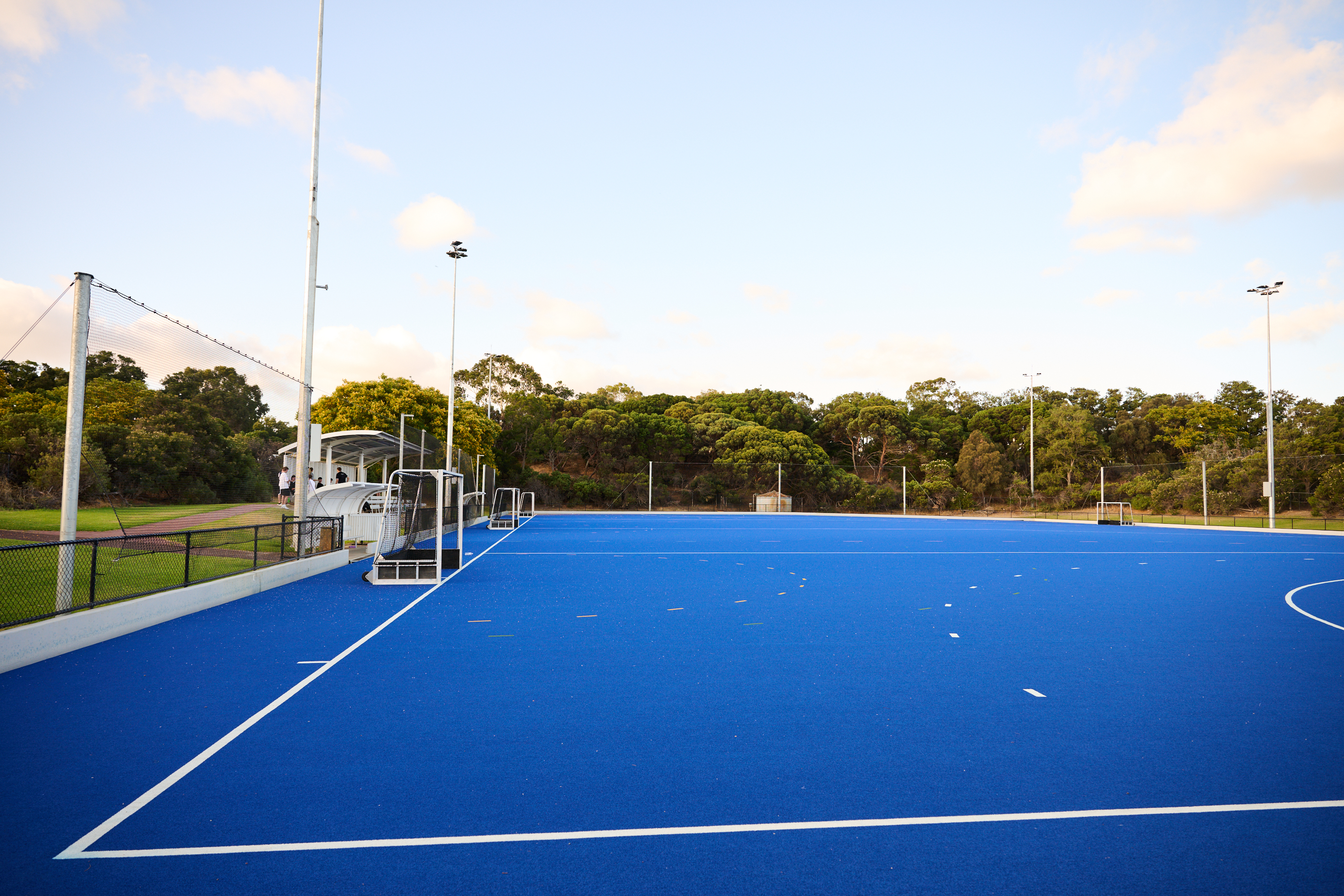 A side on photo of one of the hockey goals and surroundng astroturf located on the astroturf at Arena Joondalup
