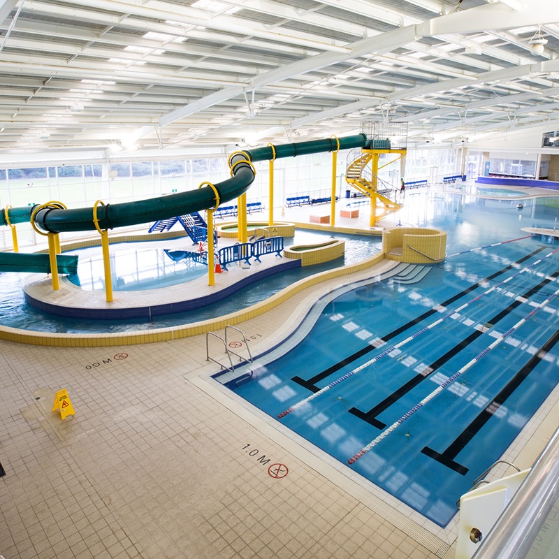A photo of the indoor waterslide and family pool facilities at HBF Arena in Joondalup, Perth