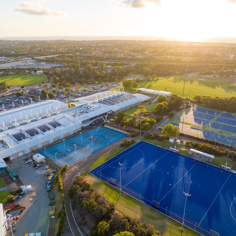 An aerial shot of the Arena Joondalup complex, focusing on the hockey and netball courts