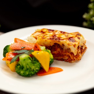 Beef lasagne with bechamel sauce and mozzarella cheese